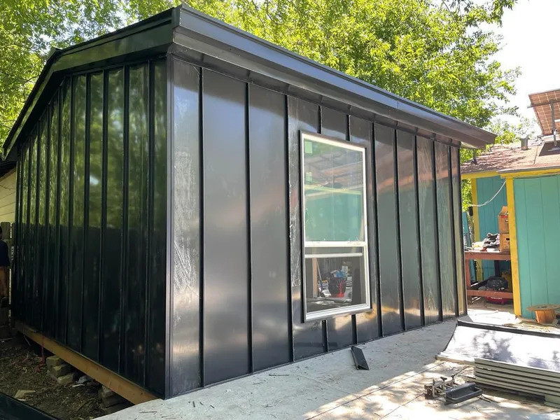 Black standing seam metal wall panels for Roof Inspection in Lynn Haven